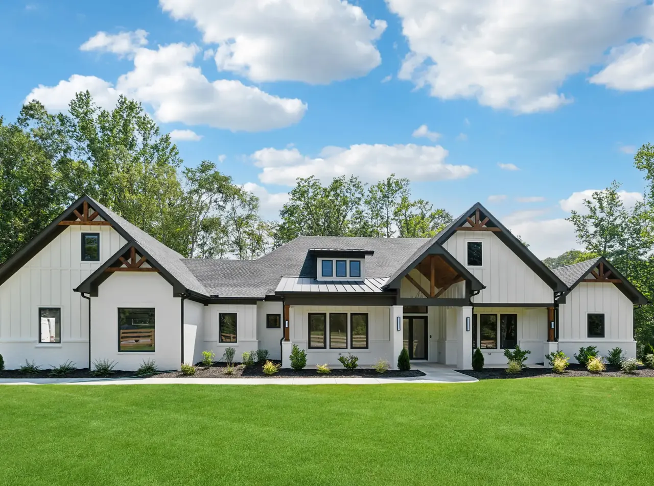 Project 938, a white brick and board-and-batten farmhouse built by A&S